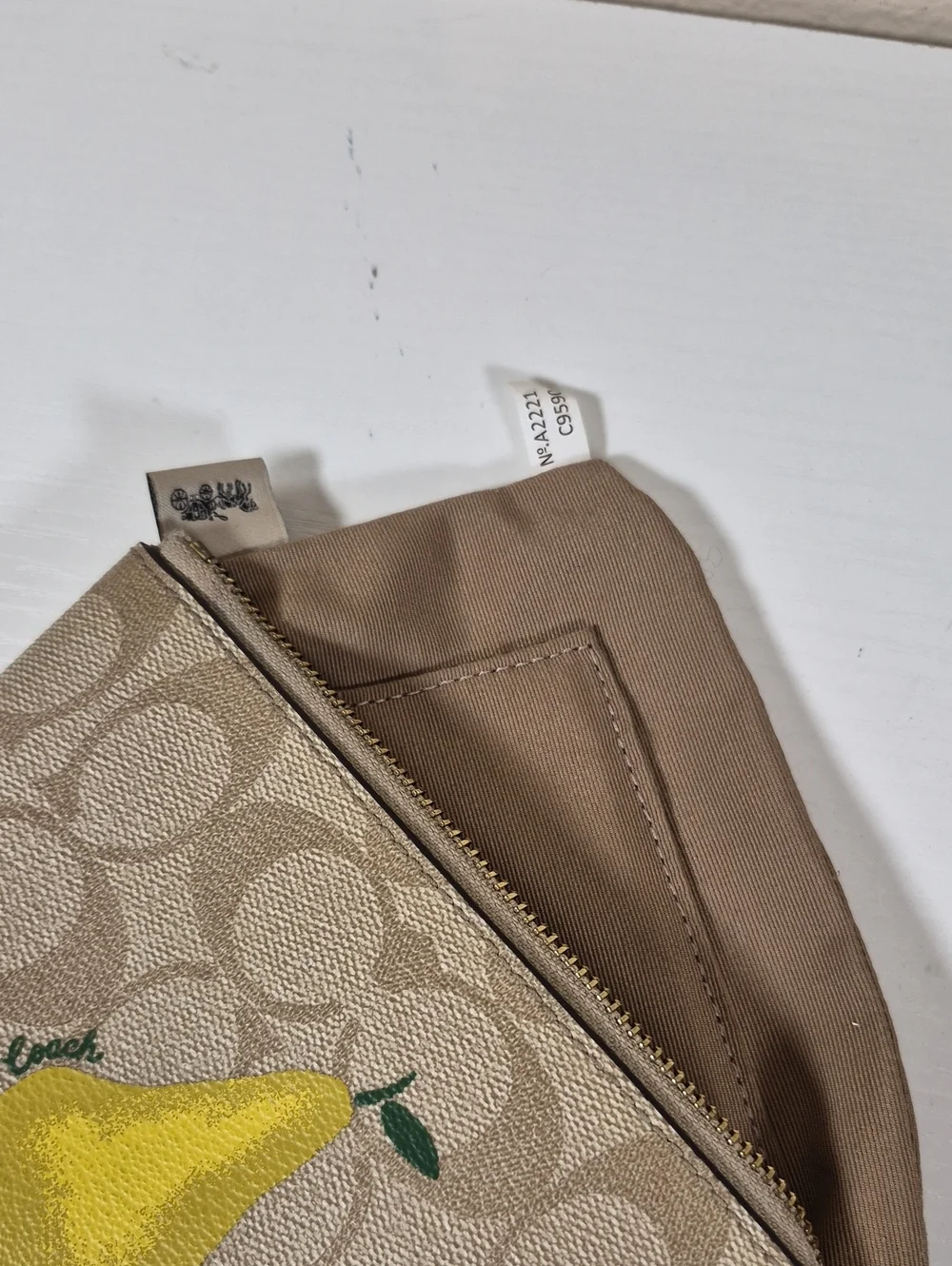 Coach Corner Zip Wristlet In Signature Canvas With Pear